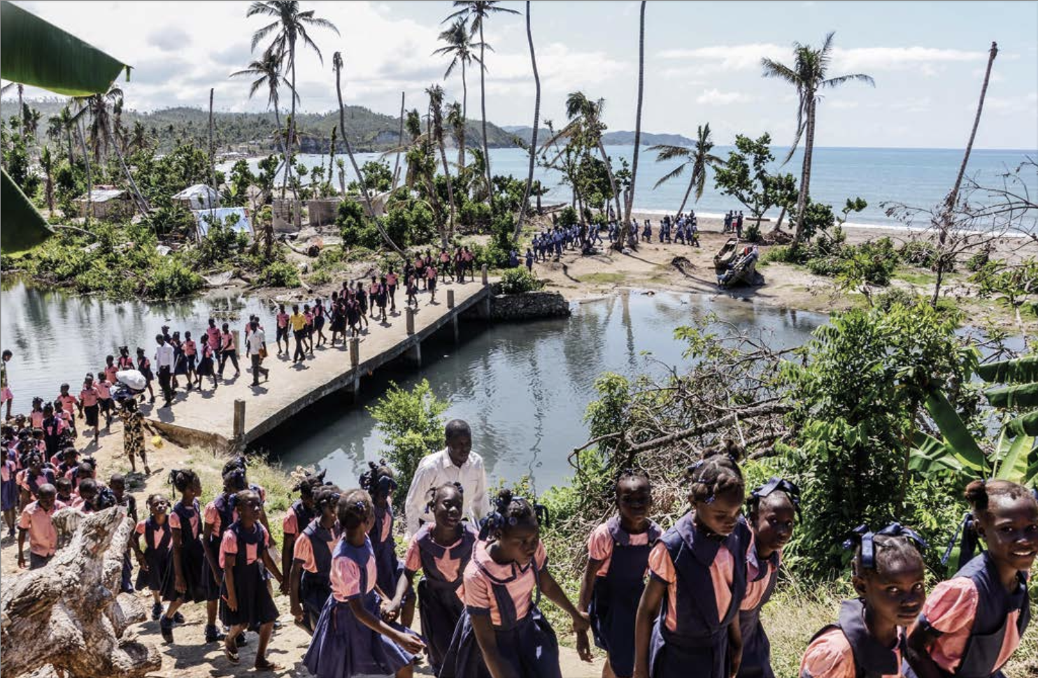 Image from K2D’s photojournalism project, Urgences. Months after a hurricane, students walk back to school in the town of Anse d’Ainaut, in the Grande Anse region. Photograph by and courtesy of Georges Harry Rouzier.