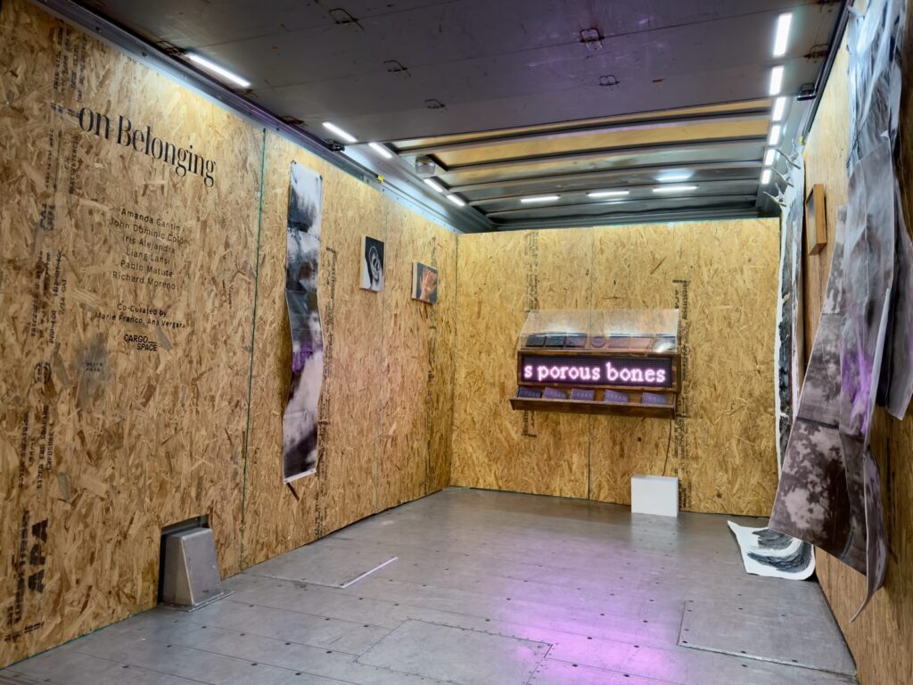 From left, works by Amanda Cantin, John Dominic Colón, Iris Alejandra, Liang Lansi, Pablo Matute and Richard Moreno in Cargo Space’s “On Belonging.” (Photo courtesy of Cargo Space).