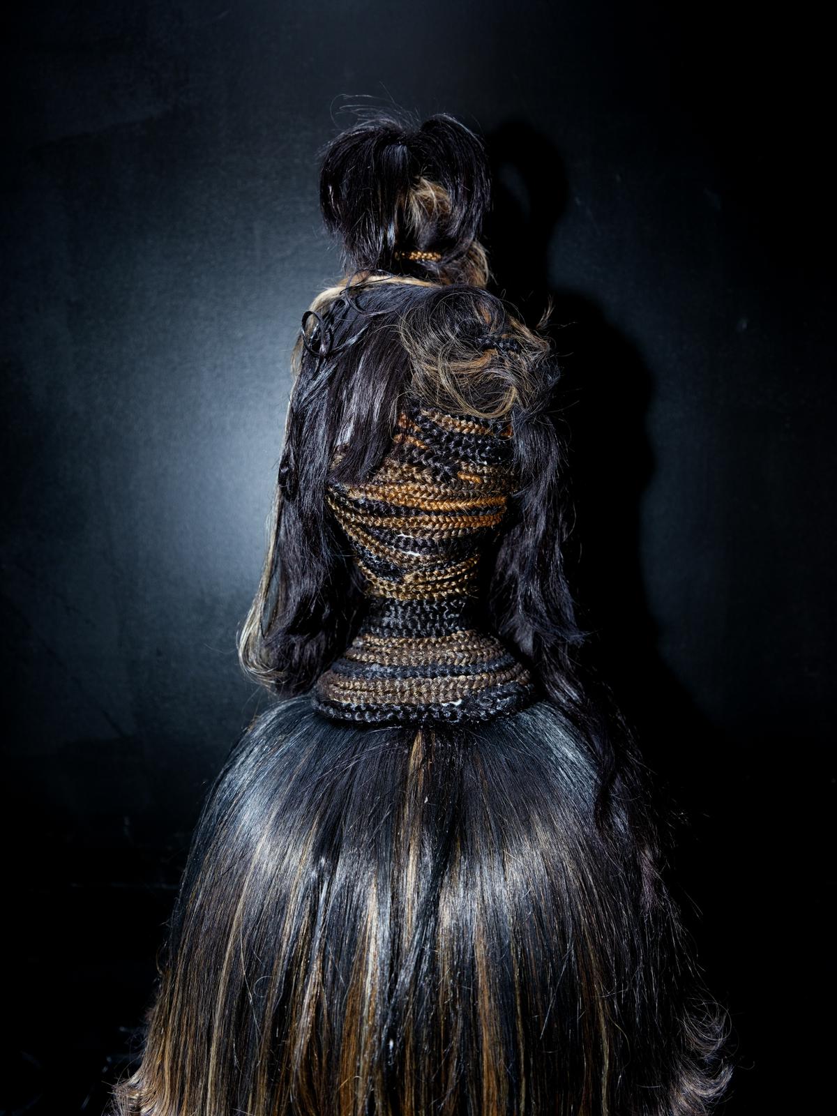 Bust attached to drier cap in The First Lady (2025). Photos courtesy of Christopher Auguste.