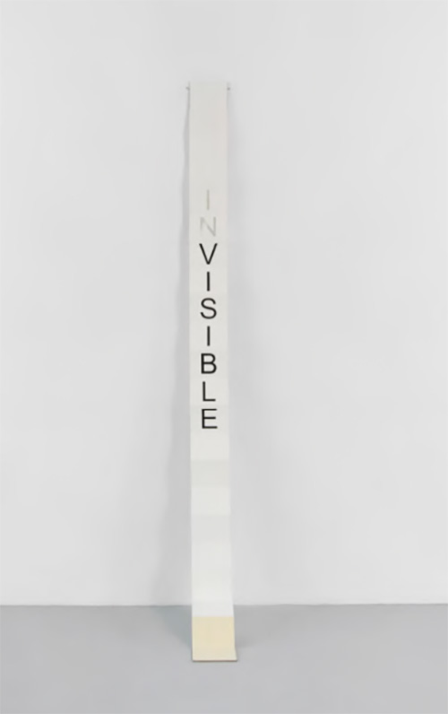 Javier Martin’s INvisible, 2023. artist book from "Words Matter" series. Photo courtesy of Laundromat Art Space. Photo linked to a video.